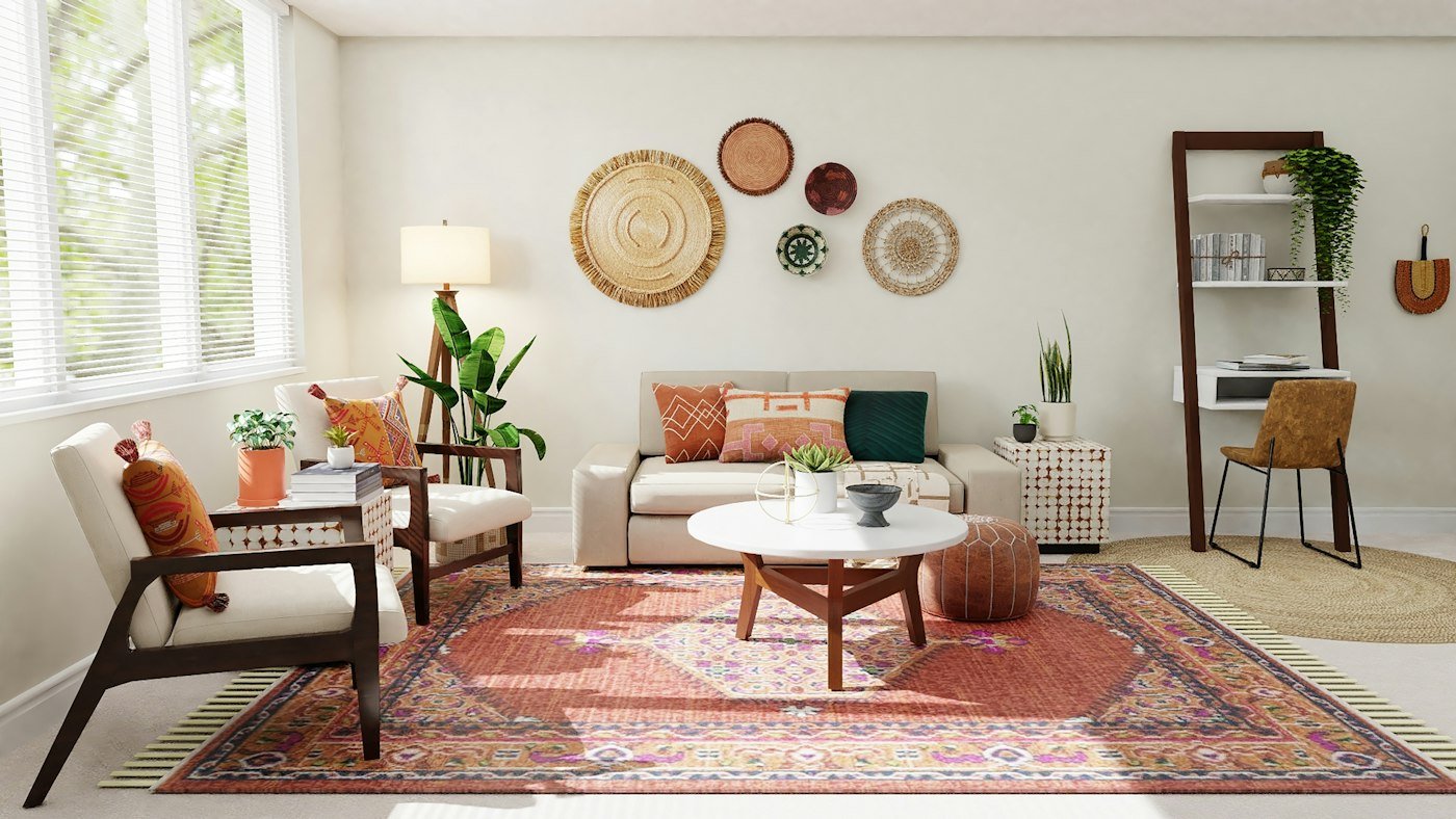 A beige sofa, two armchairs, a red patterned rug, and round woven hangings on the wall